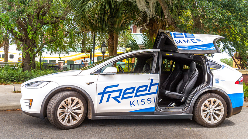 Landing Page image - Freebee vehicle parked at Kissimmee/Amtrak station.