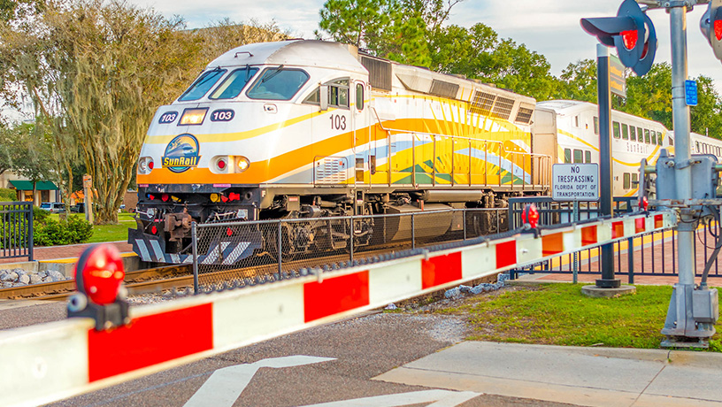 Landing Page image - SunRail train pulling into the Winter Park/Amtrak station.