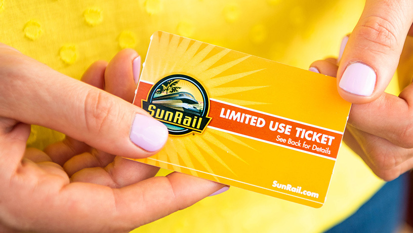 Landing Page image - Woman holding a SunRail Ticket