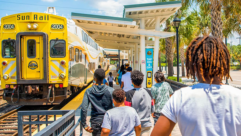 Landing Page image - Group of kids approaching SunRail Train for a group ride