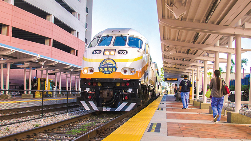 Landing Page image - AdventHealth Station and SunRail Train with riders approaching train