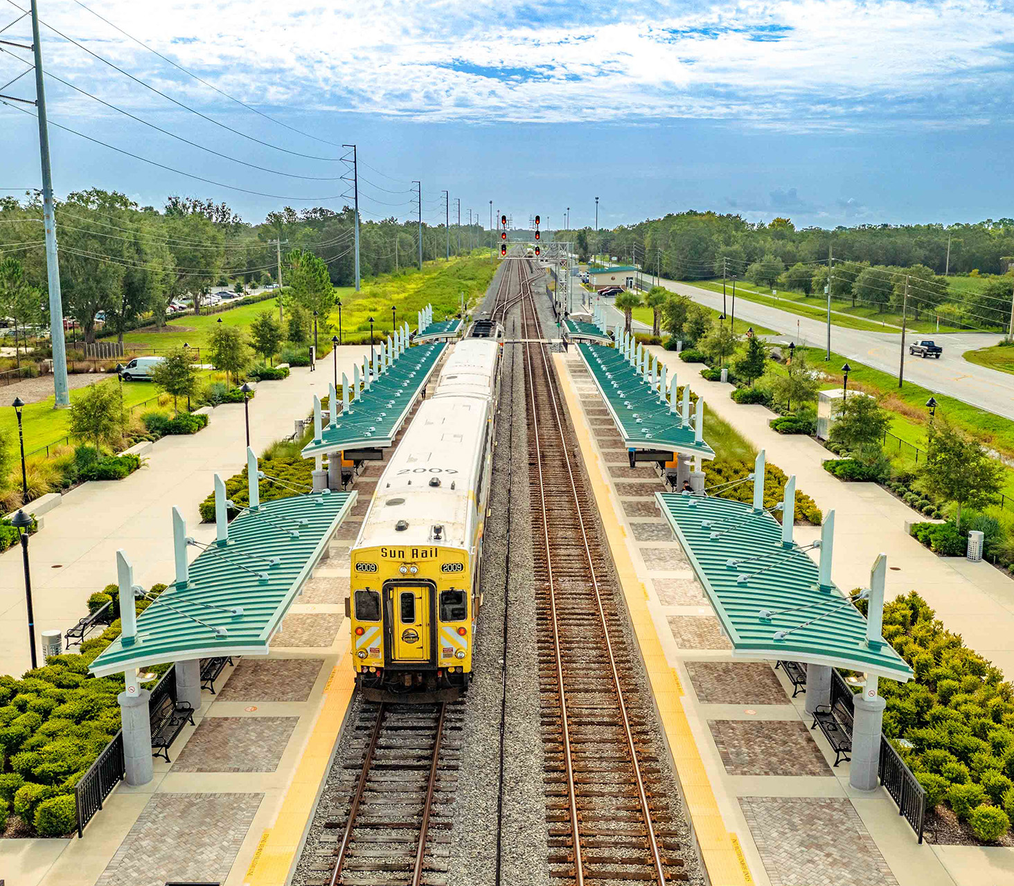 Aerial image of SunRail Train at Poinciana Station.