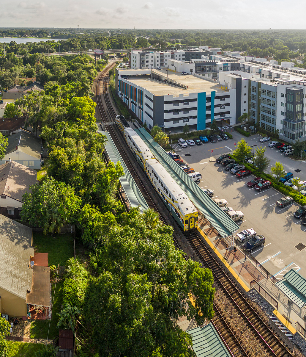 Aerial image of SunRail Train at Maitland Station with apartments in the background