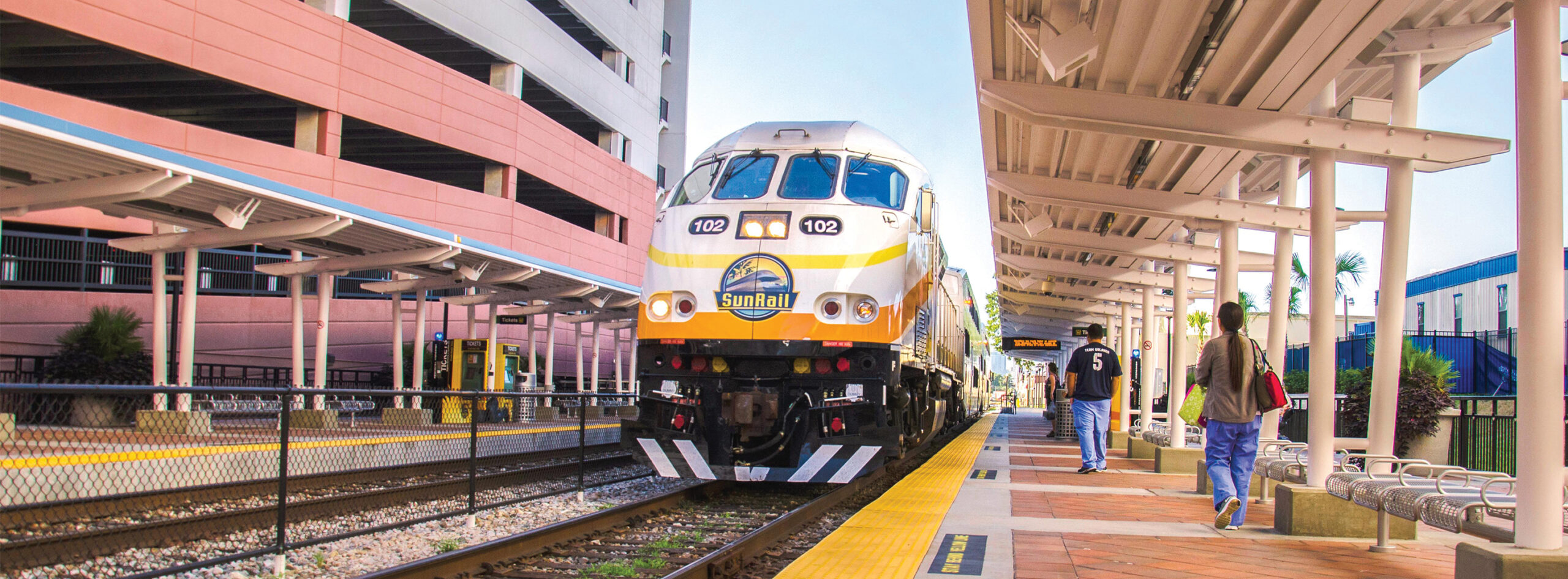 Masthead image - AdventHealth Station and SunRail Train with riders approaching train
