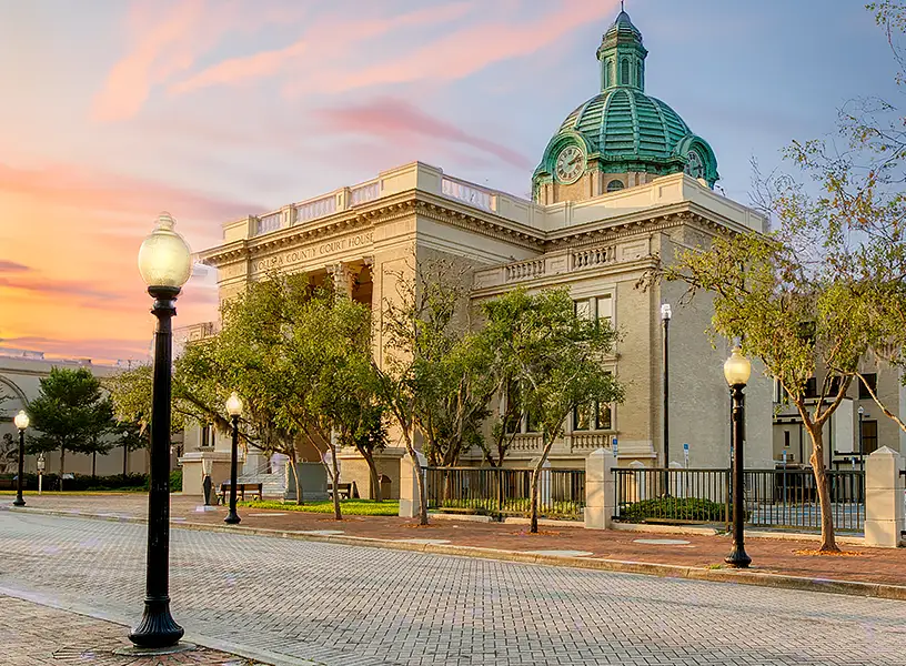 City hall in historic Downtown DeLand with sunset in background.