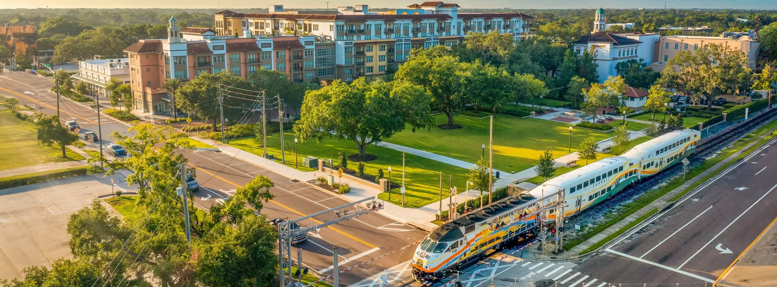 A SunRail train traveling through downtown Maitland in the morning.