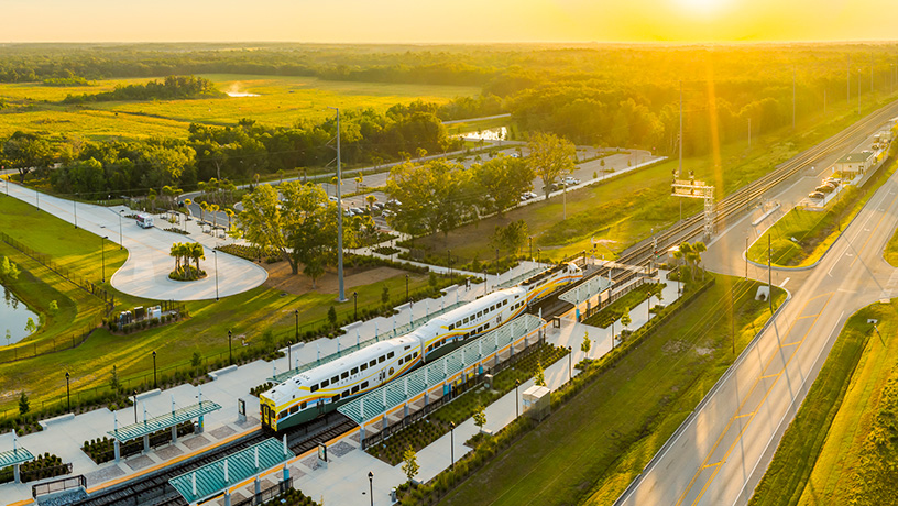 Landing Page Image - Aerial image of Poinciana Station and SunRail Train