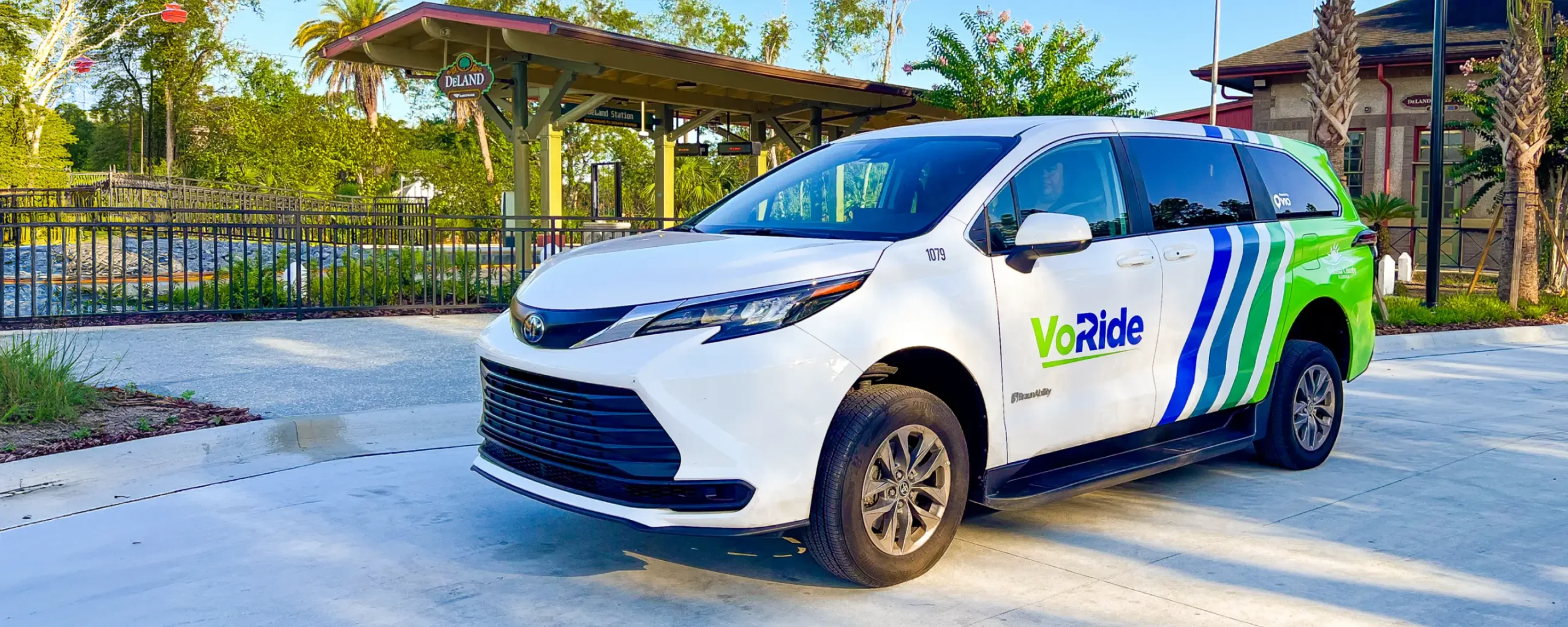 Masthead image - Freebee vehicle parked at Kissimmee/Amtrak station.