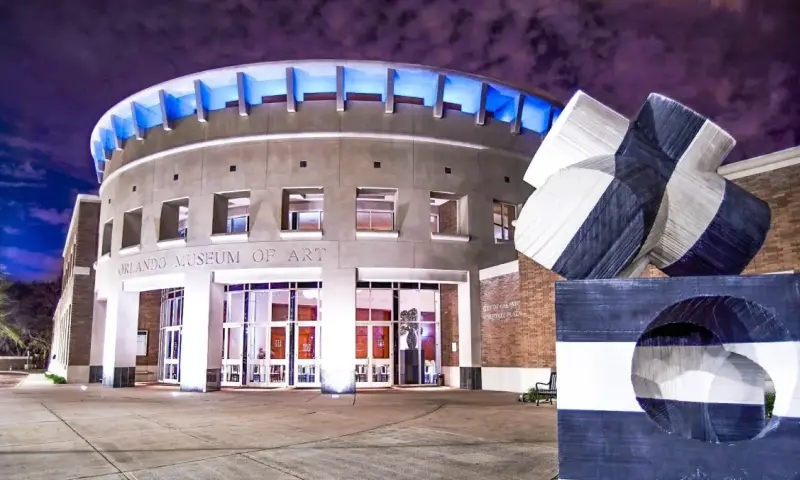 Exterior view of the Orlando Museum of Art at night highlighting the Access for All community event.