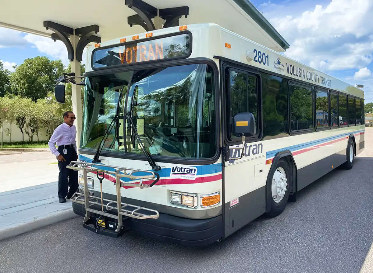 Man waiting to board a Votran bus.